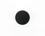 Circular black rubber cap with a segmented, petal-like pattern and a central center hole